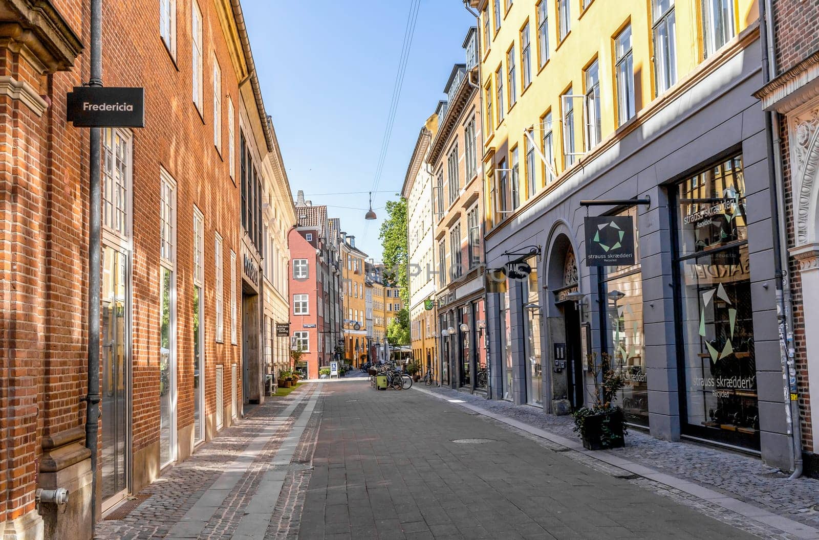 Downtown Copenhagen with old colored houses on a sunny day. Copenhagen, Denmark - September 30, 2023
