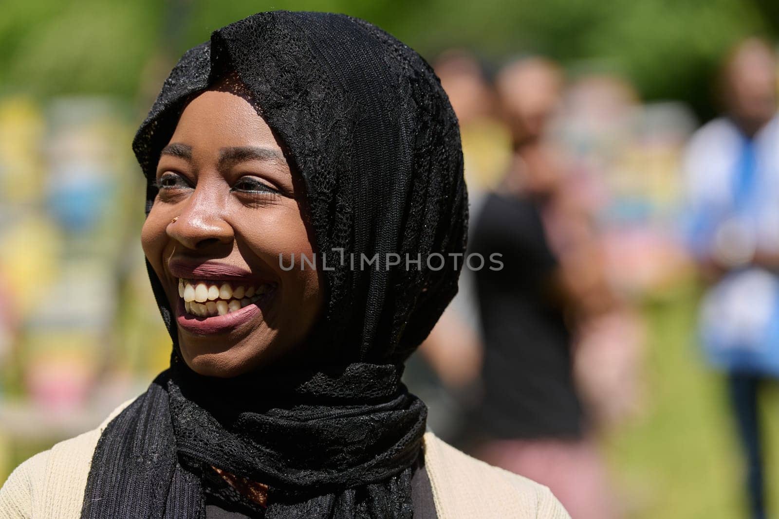 A Middle Eastern Muslim woman in a hijab beams with a radiant smile in a picturesque natural apiary, exuding joy and harmony