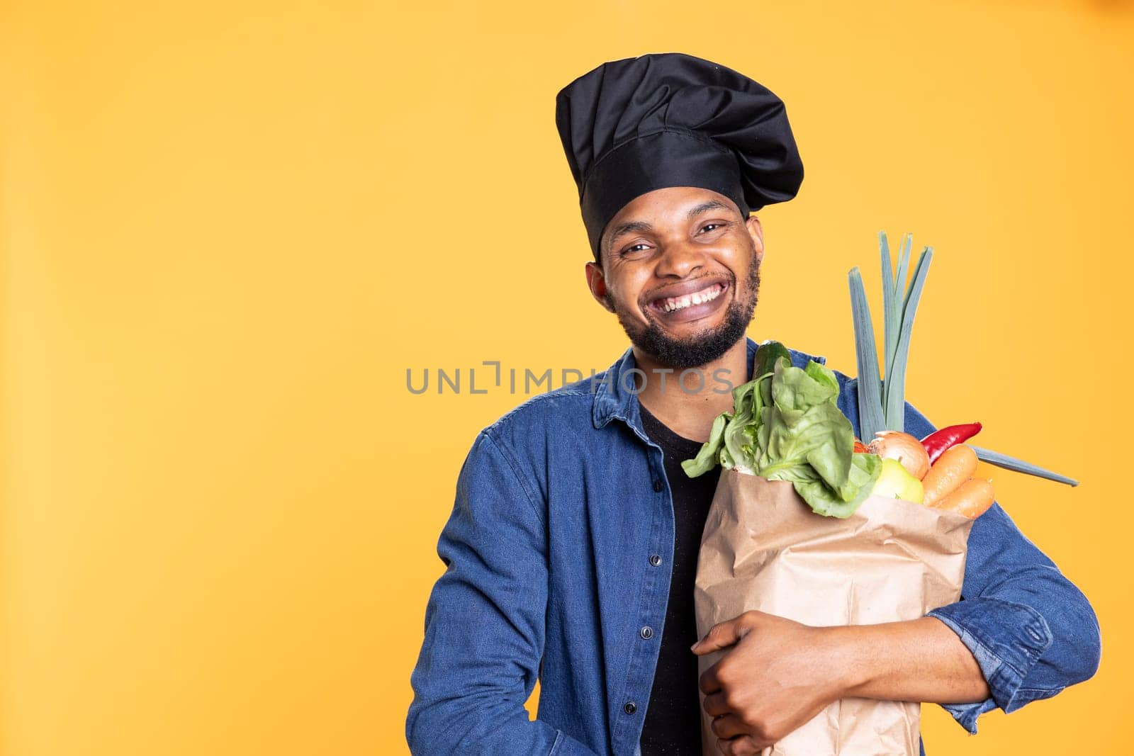 African american male chef buying fresh groceries to prepare a special recipe by DCStudio