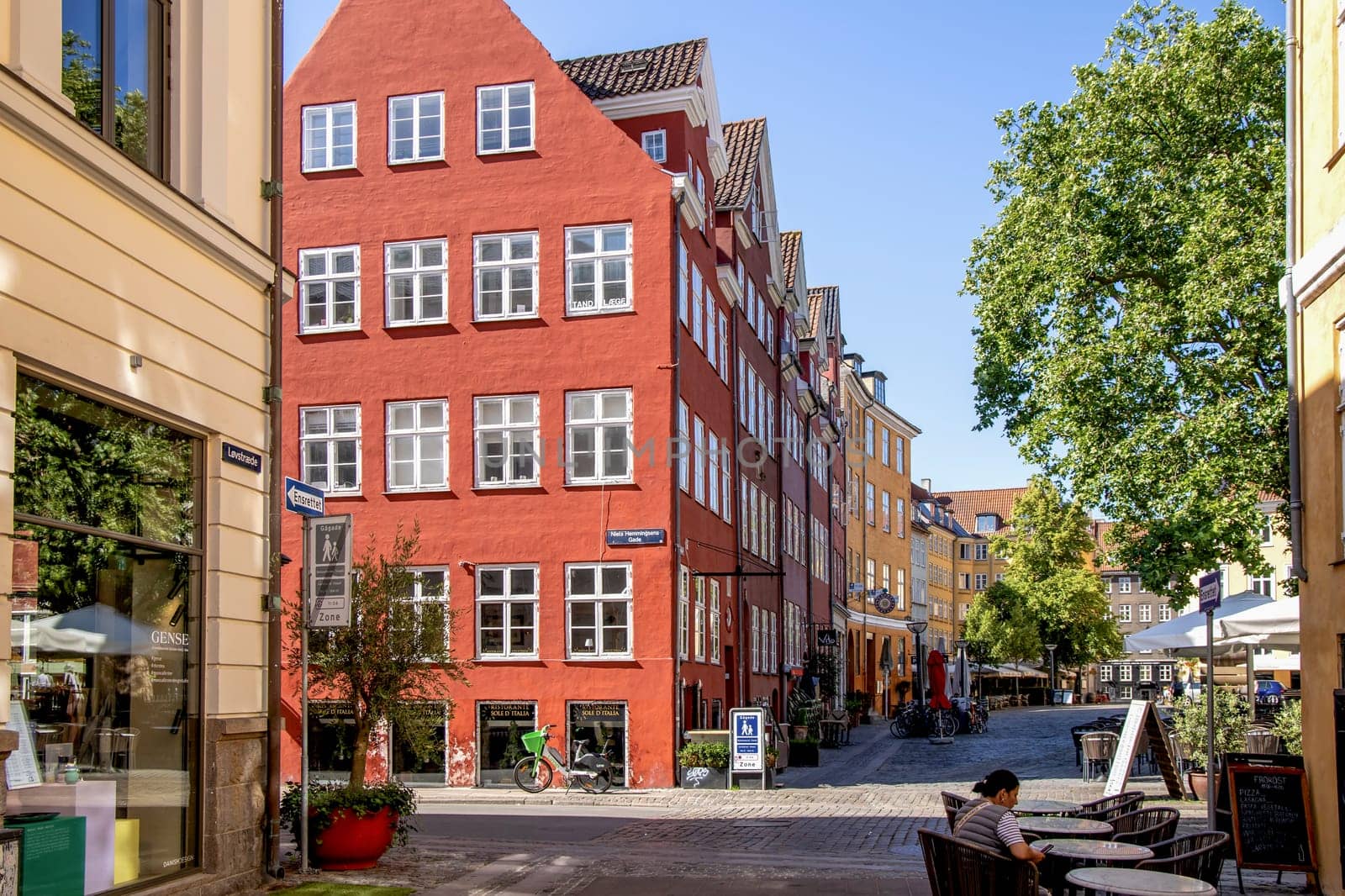 Downtown Copenhagen with old colored houses on a sunny day. Copenhagen, Denmark - September 30, 2023