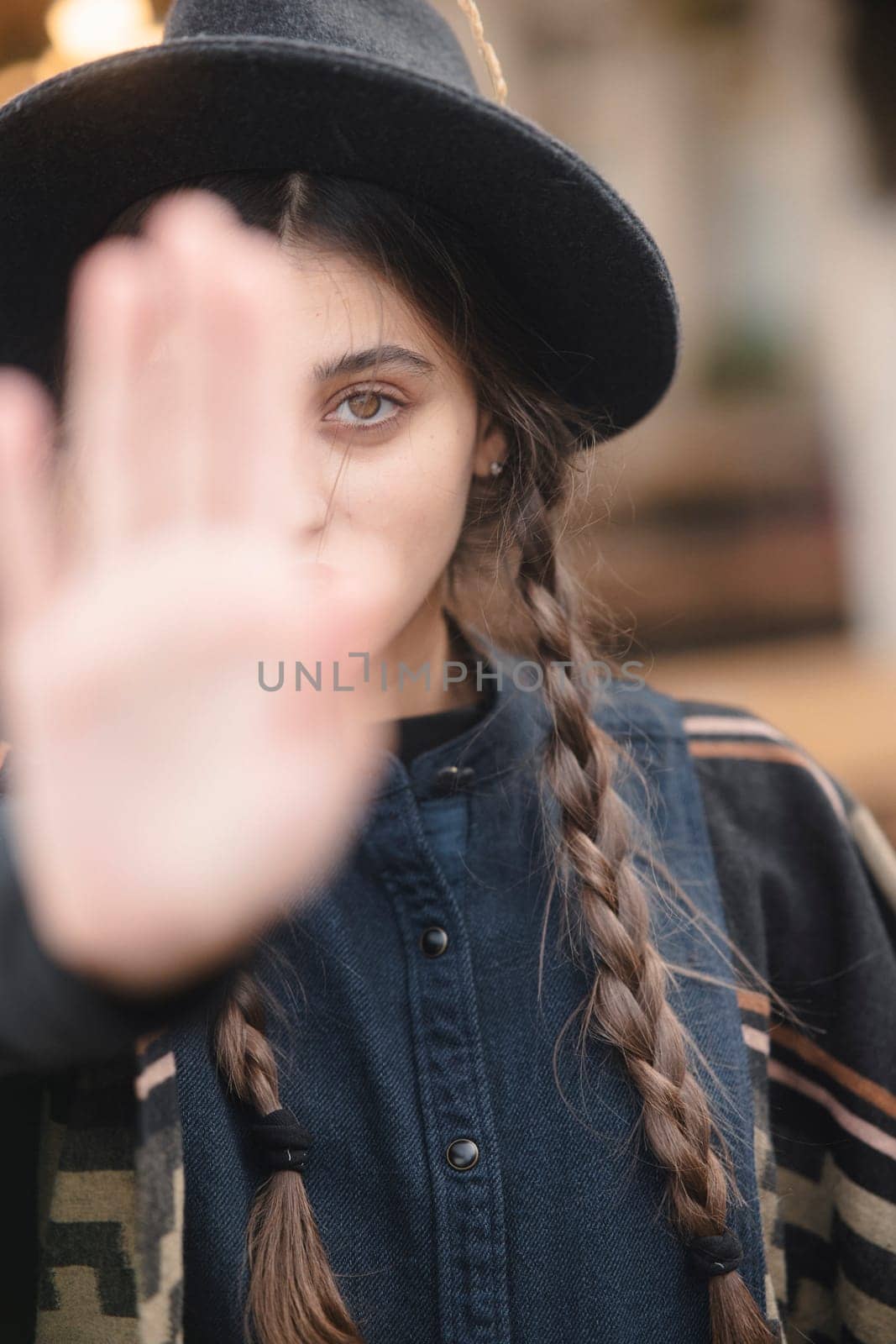 A portrait of a stylish young woman exuding retro hippie vibes. High quality photo
