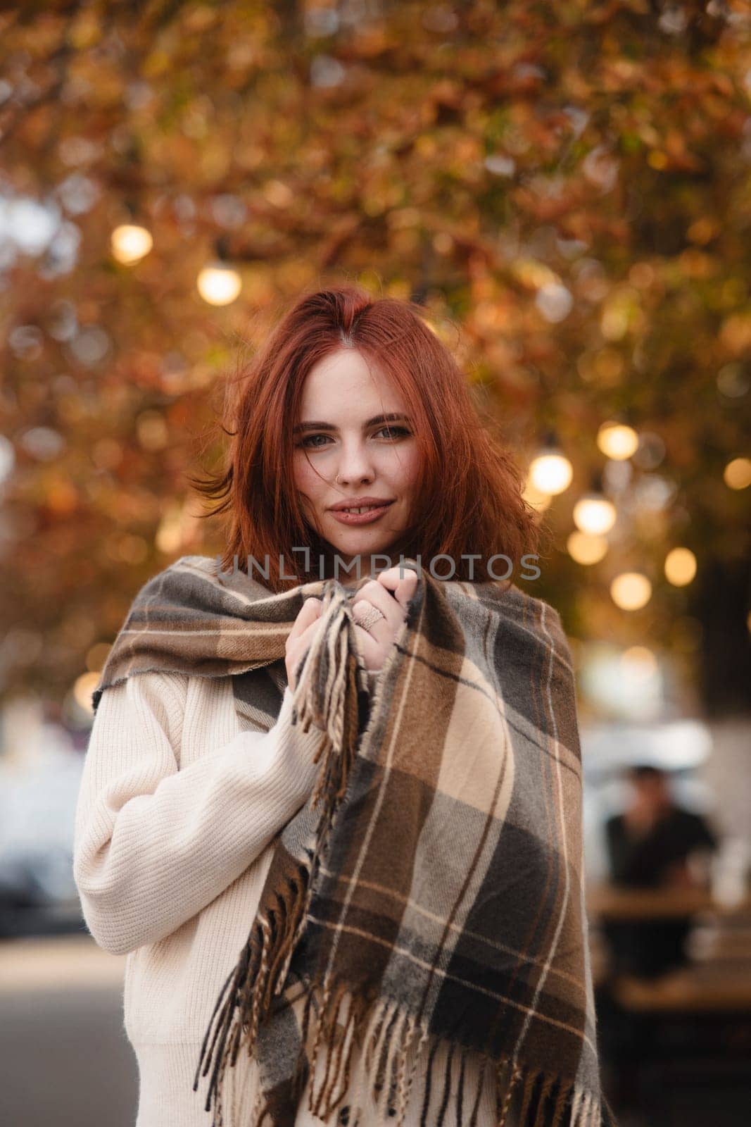 A dazzling redhead embracing the spirit of hippie culture on a sunny fall day. High quality photo