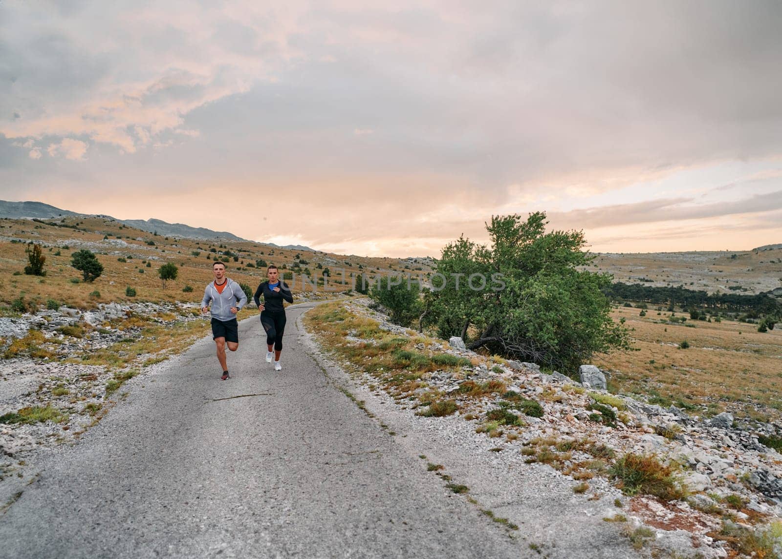 A Couple's Energizing Morning Run in the Mountains by dotshock