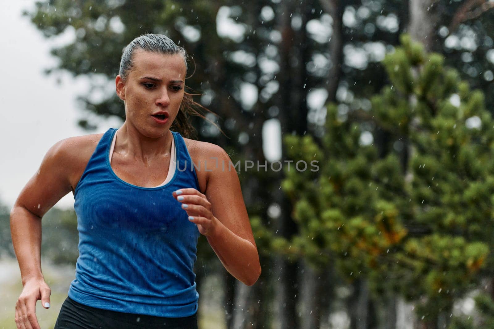Unstoppable: A Determined Athlete Trains Through the Rain in Pursuit of Marathon Glory by dotshock