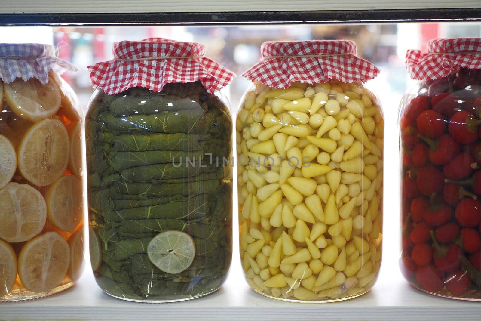 Canned fruits and vegetables in glass jars.