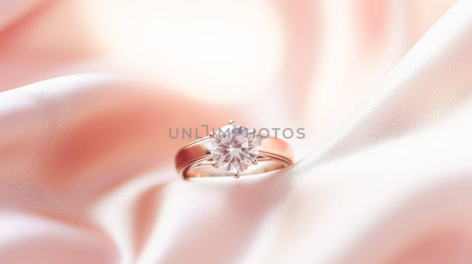 Jewellery, proposal and holiday gift, diamond engagement ring on pink silk fabric, symbol of love, romance and commitment inspiration