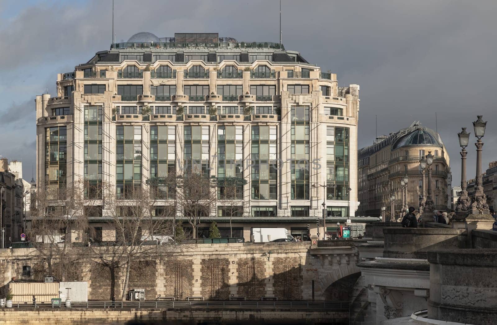 France, Paris - Jan 03, 2024 - Facade of the Samaritaine department store in Paris. Famous building with Pont Neuf in the foreground. Space for text, Selective focus.