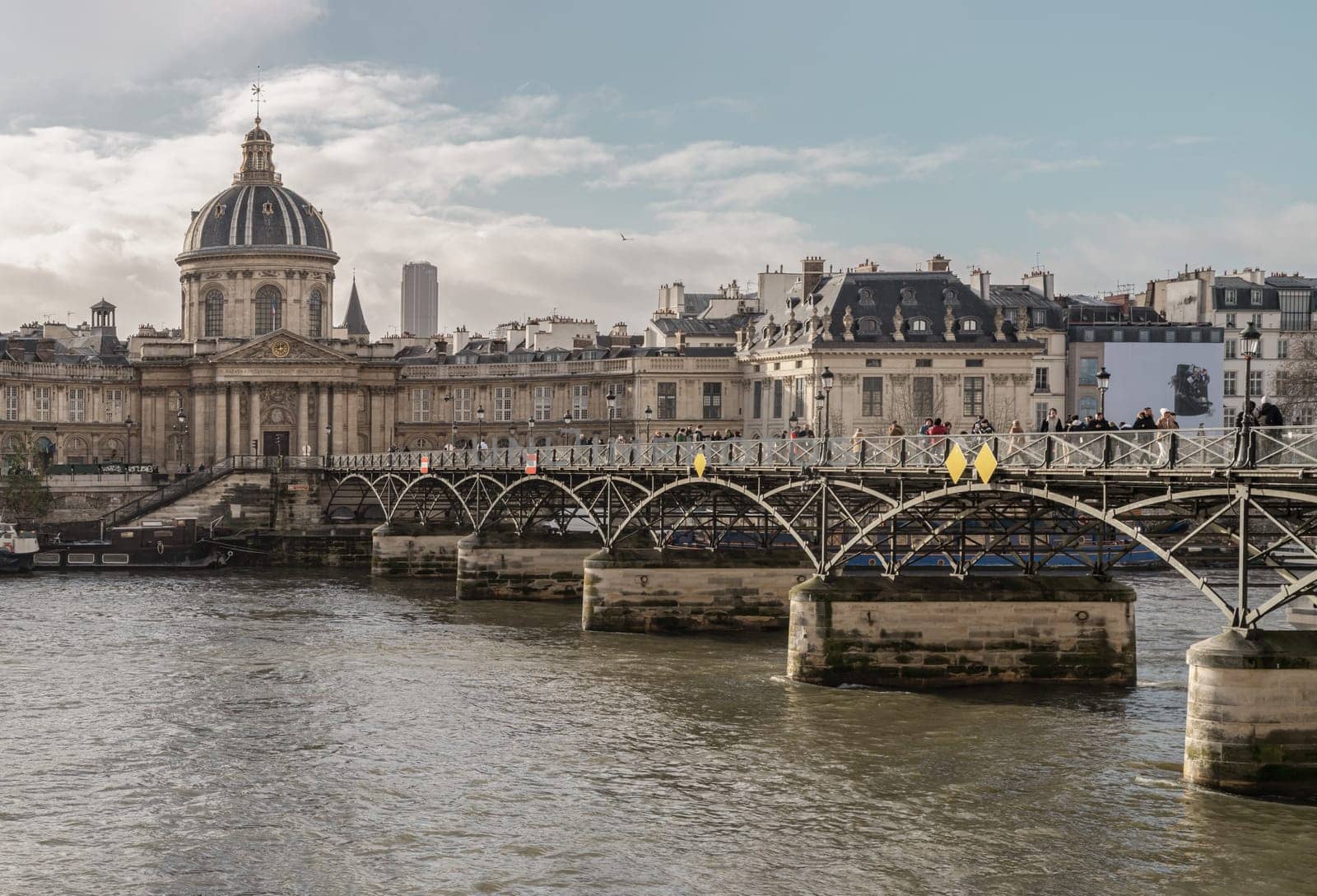 France, Paris - Jan 03, 2024 - Pont des arts (Passerelle des arts) is a pedestrian bridge which across the seine river to The Institut de France in Paris. Space for text, Selective focus.