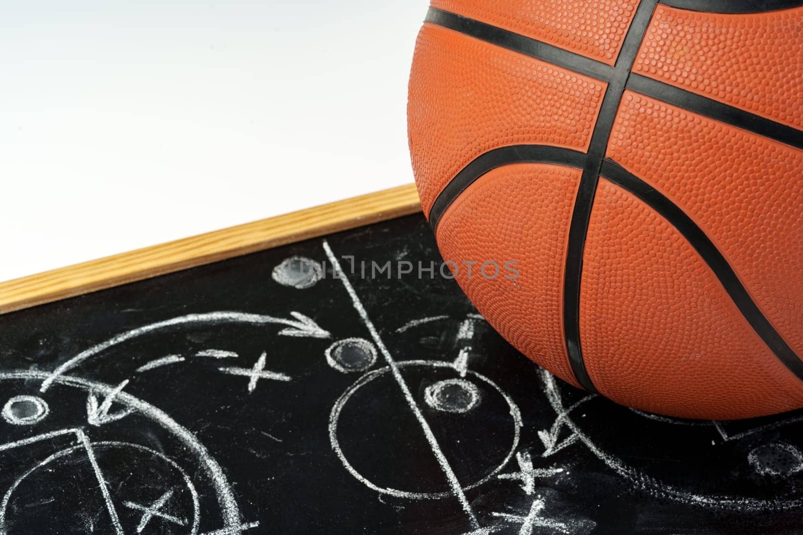 Basketball ball with chalkboard strategy planning close up photo