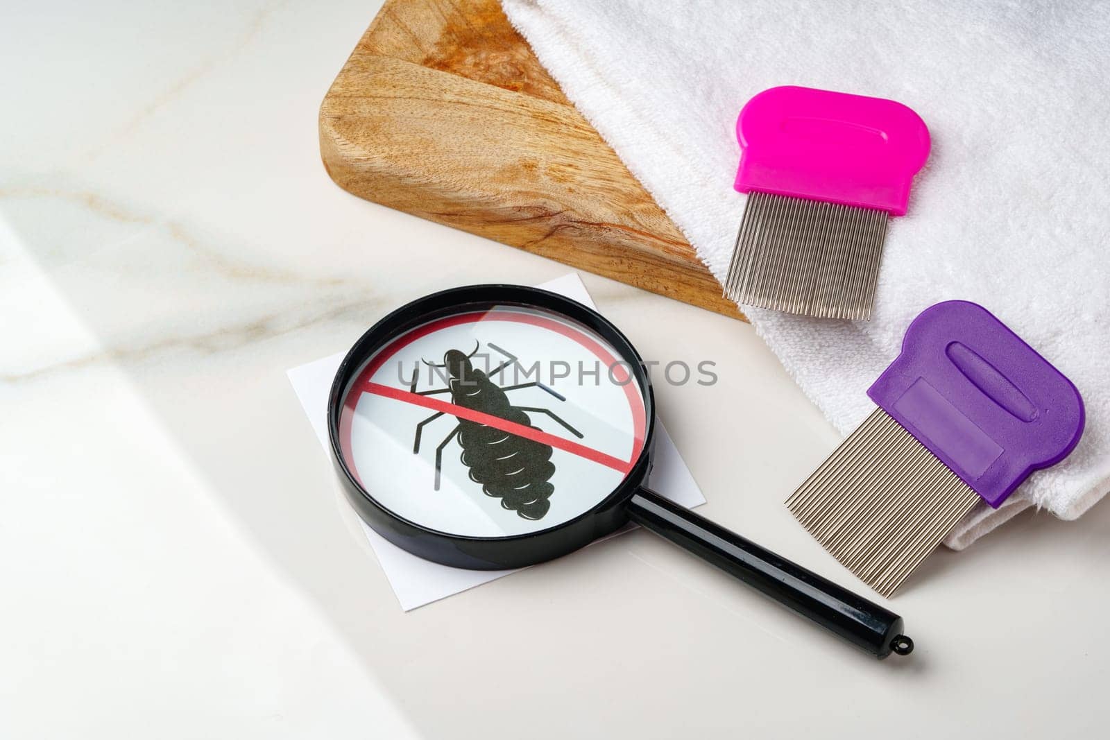 Anti lice combs and towel on white background by Fabrikasimf