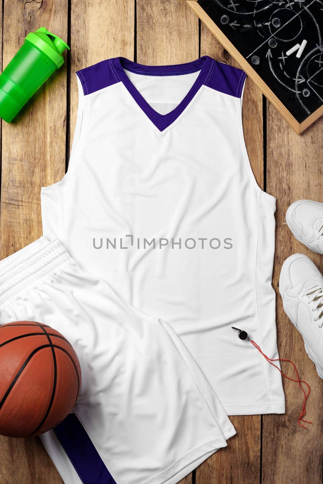 Basketball uniform on wooden background top view flat lay