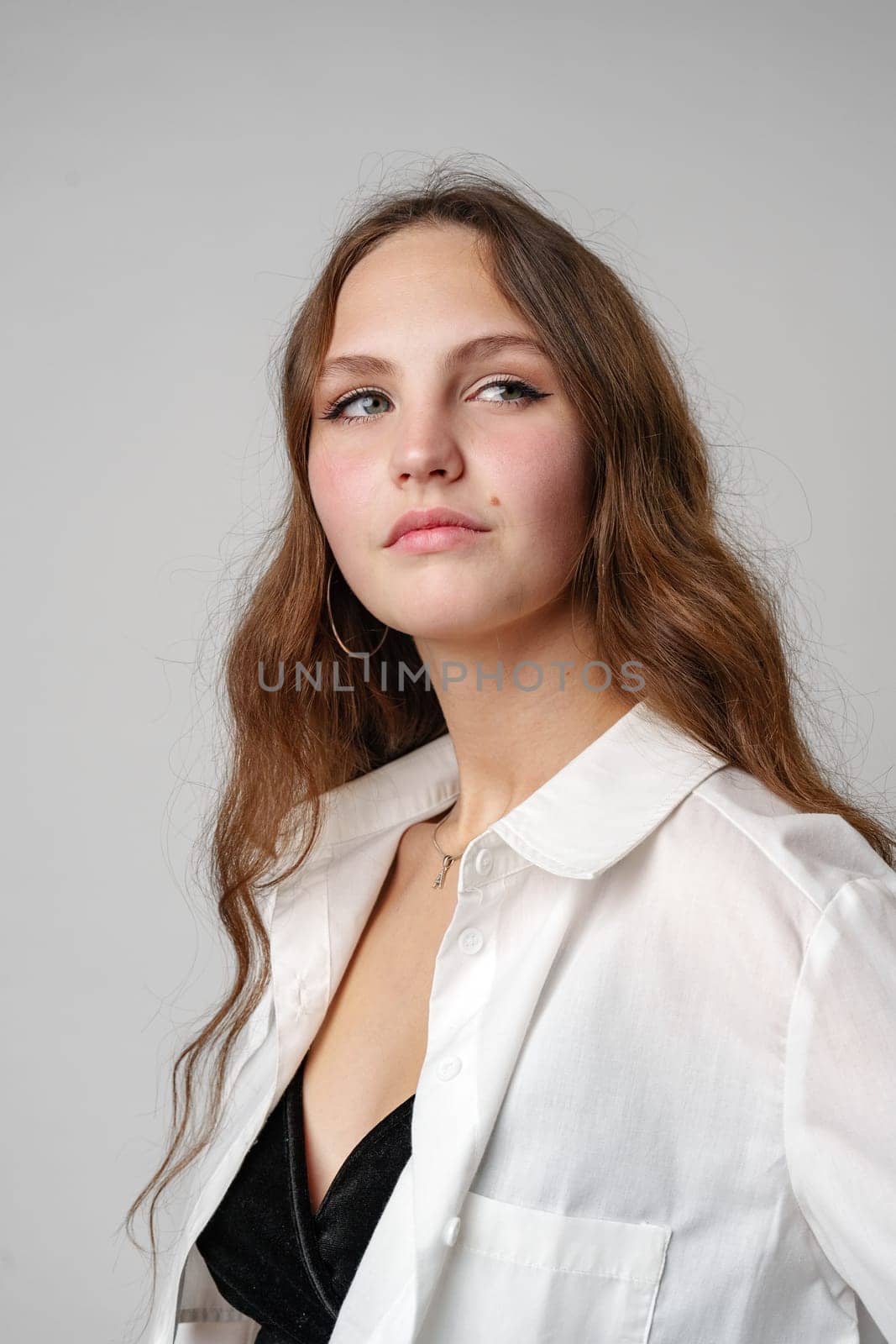 Woman With Long Hair Wearing White Shirt by Fabrikasimf