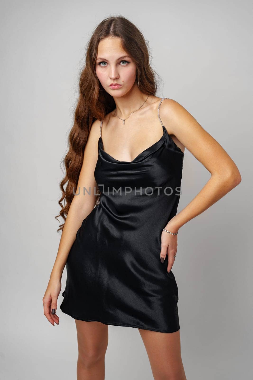Woman in Black Dress Posing for Picture by Fabrikasimf