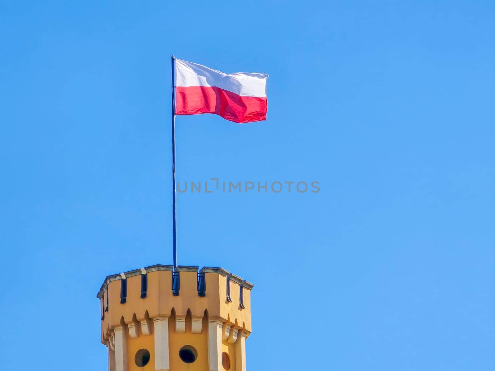 Polish flag on the tower - white and red. High quality photo