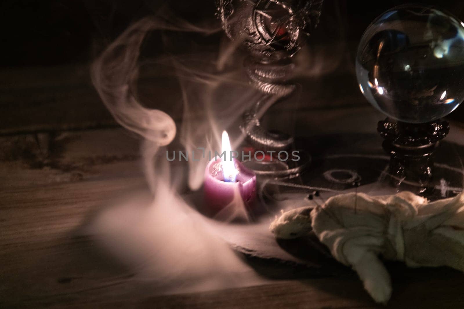 Mysterious Occult Ritual Setup with Crystal Ball and Candles