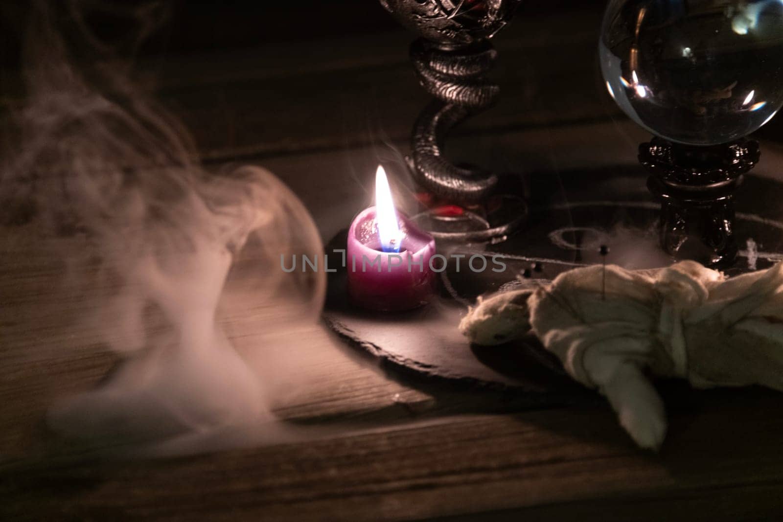 Mysterious Occult Ritual Setup with Crystal Ball and Candles