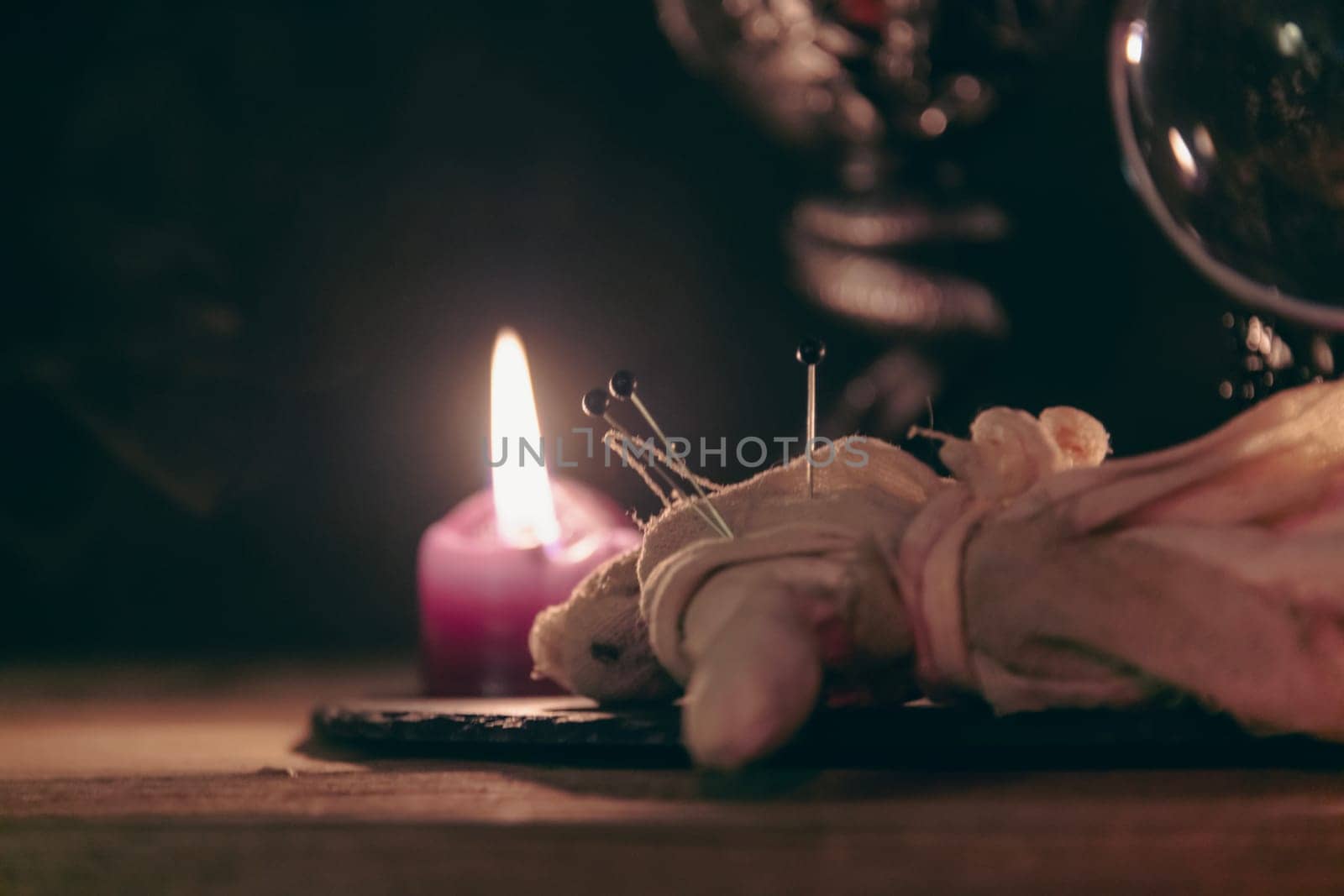 A detailed close-up shot of two lit pink candles with a dark, mystical background, emphasizing a ritualistic theme. by jbruiz78