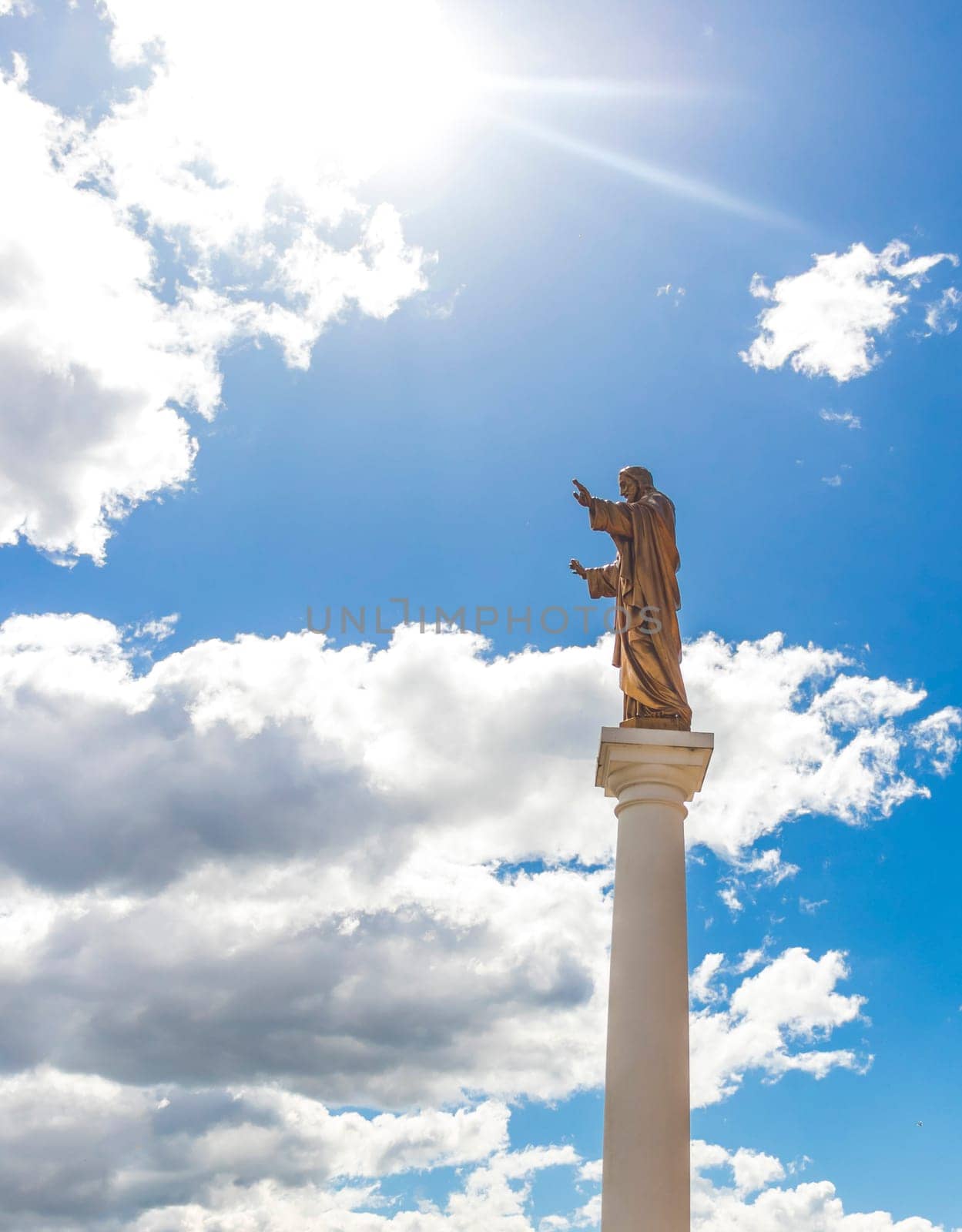 Monument to the Jesus with the blue sky on the background. Religion by pazemin