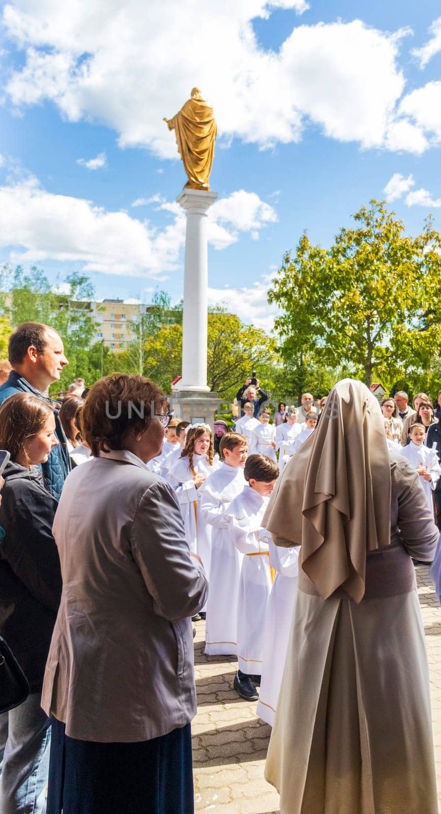 05.05.2024 - Brest, Belarus - People gathered for first communion mass at Roman catholic church. Religion by pazemin