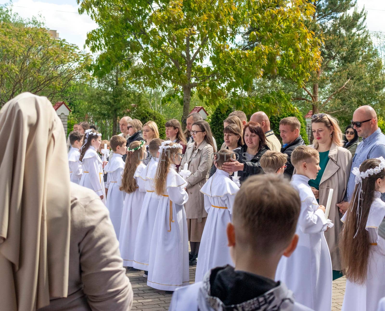 05.05.2024 - Brest, Belarus - People gathered for first communion mass at Roman catholic church. Religion by pazemin