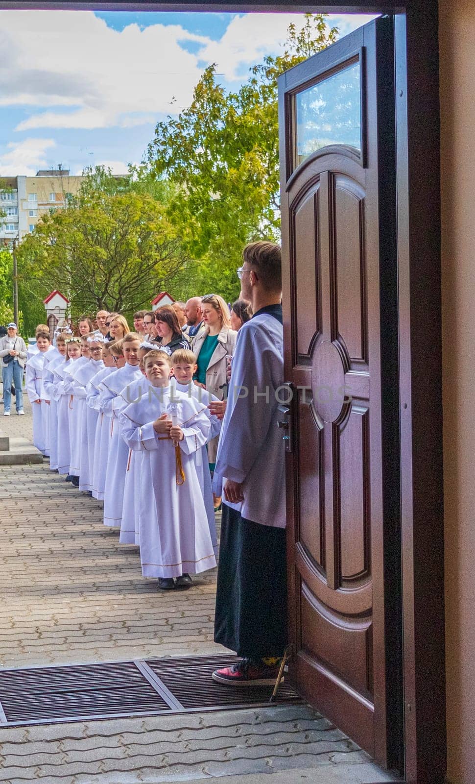 05.05.2024 - Brest, Belarus - People gathered for first communion mass at Roman catholic church. Religion by pazemin