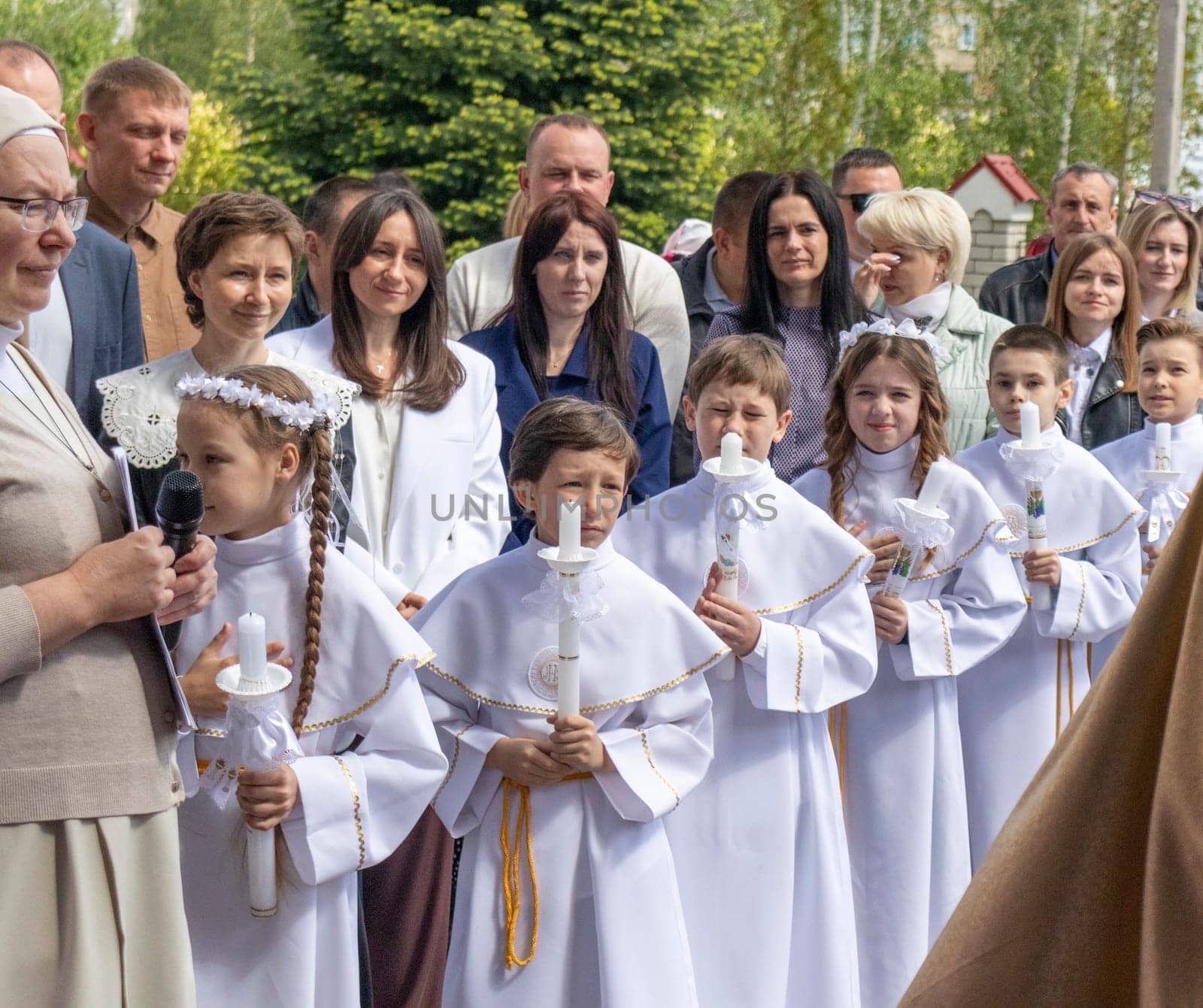 05.05.2024 - Brest, Belarus - People gathered for first communion mass at Roman catholic church. Religion by pazemin