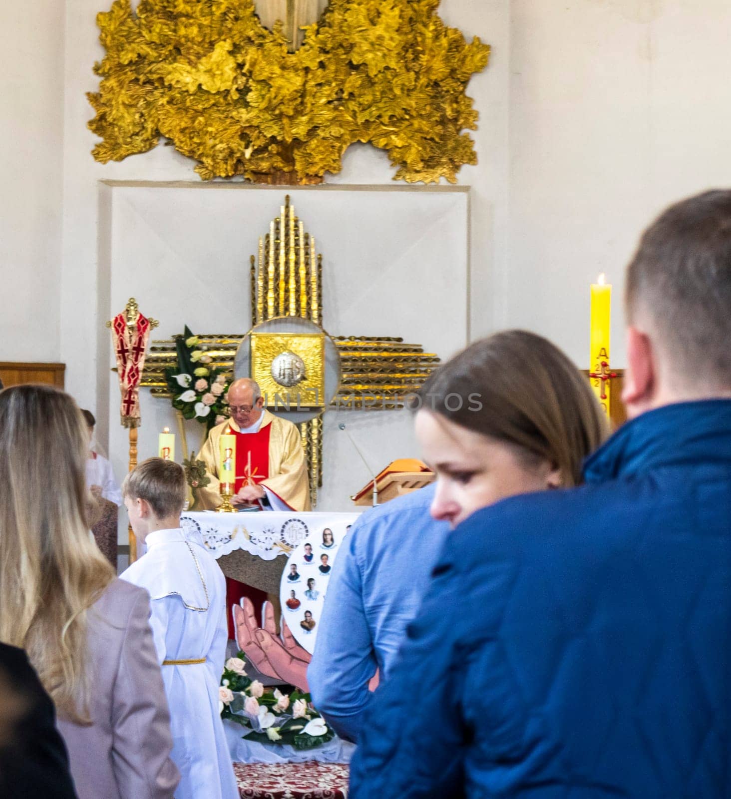 05.05.2024 - Brest, Belarus - People gathered for first communion mass at Roman catholic church.Religion by pazemin