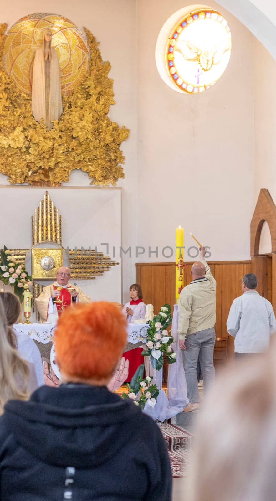 05.05.2024 - Brest, Belarus - People gathered for first communion mass at Roman catholic church. by pazemin