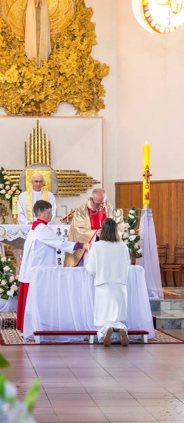 05.05.2024 - Brest, Belarus - People gathered for first communion mass at Roman catholic church. by pazemin