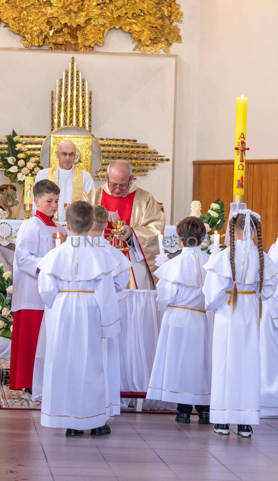 05.05.2024 - Brest, Belarus - People gathered for first communion mass at Roman catholic church.