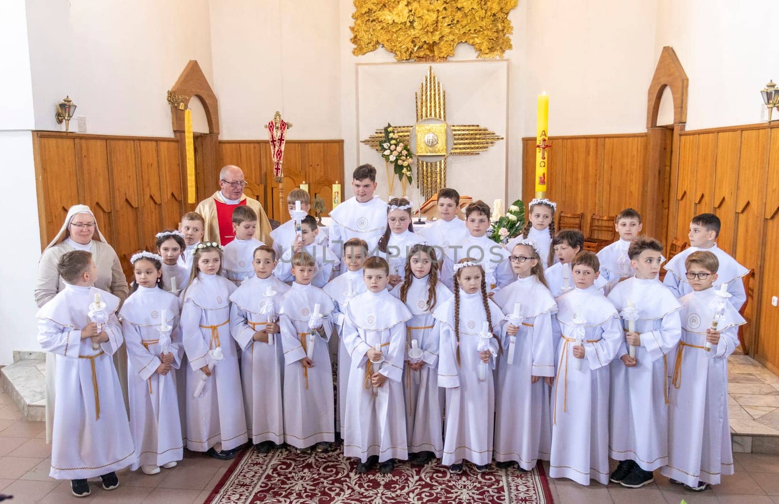 05.05.2024 - Brest, Belarus - People gathered for first communion mass at Roman catholic church.