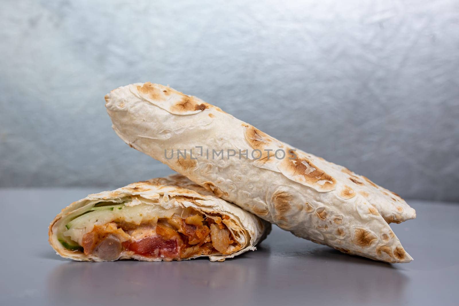 doners in pita bread with chicken filling and vegetables.