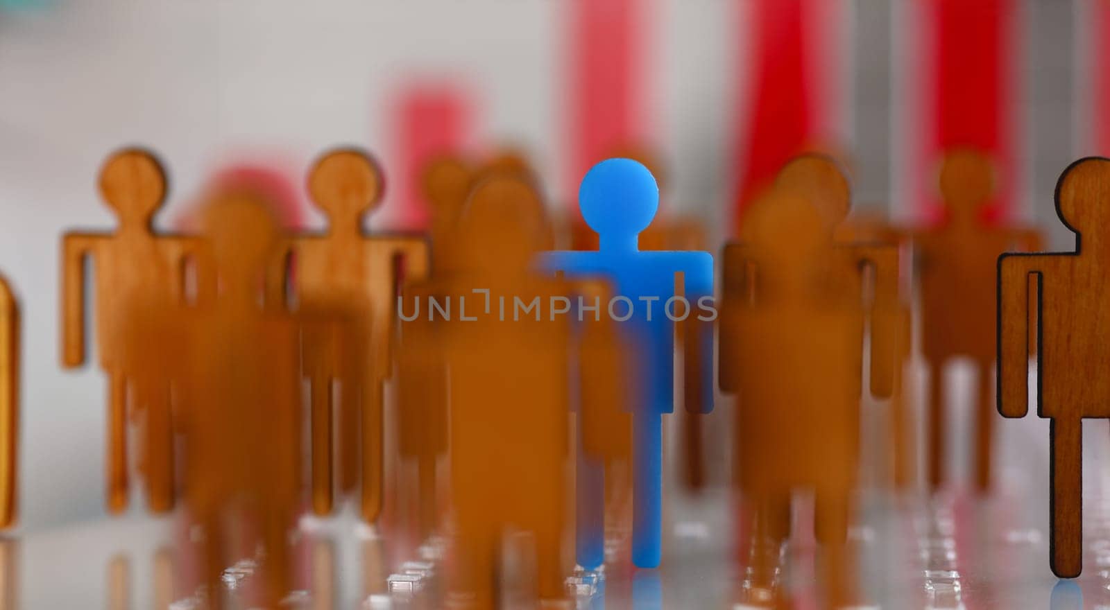 Little plastic blue toy figure stand out from unit crowd line closeup. One worker against odd hr job shift head hunter rare disease unit dismissal retire lgbt media virus epidemic success concept