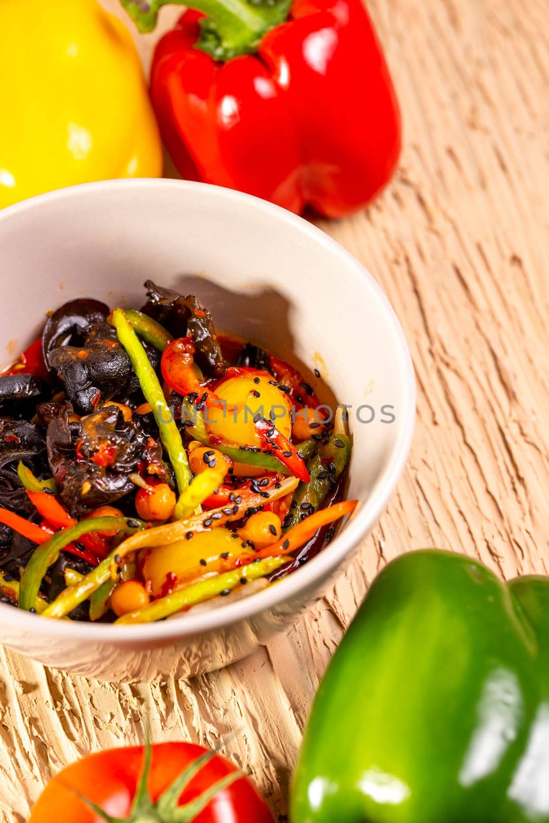 Colorful vegetable salad with tomatoes, peppers, and cucumbers by Pukhovskiy