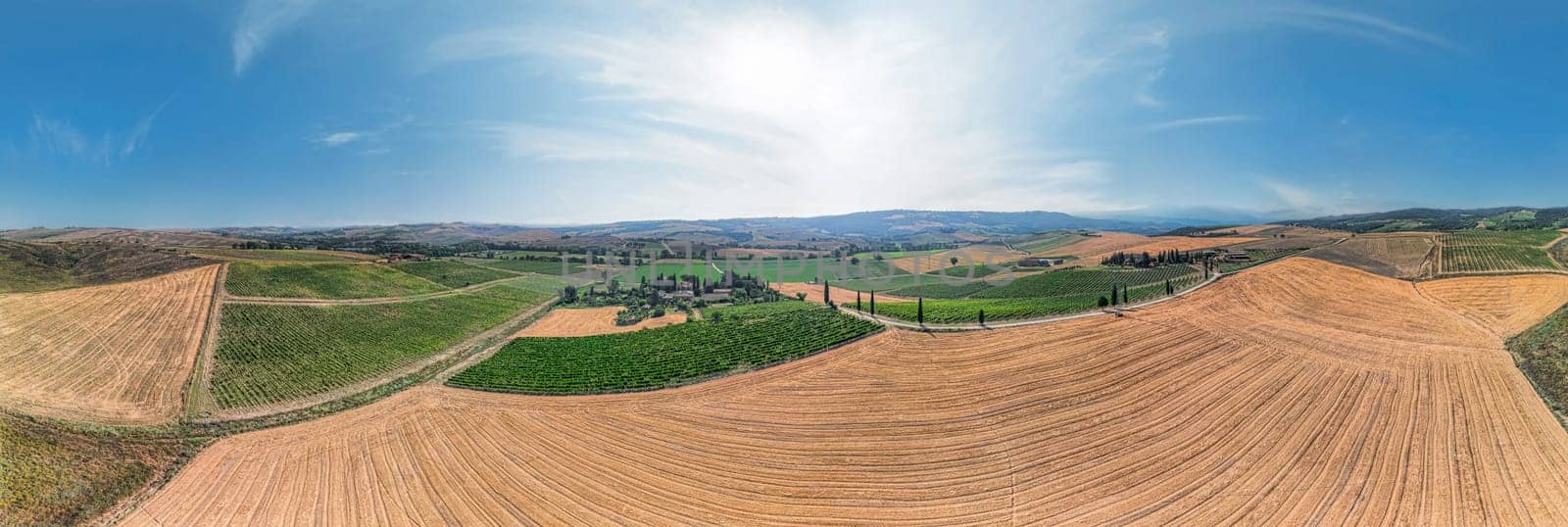 Tuscan landscape on a road of cypress trees near San Quirico d Orcia, Italy