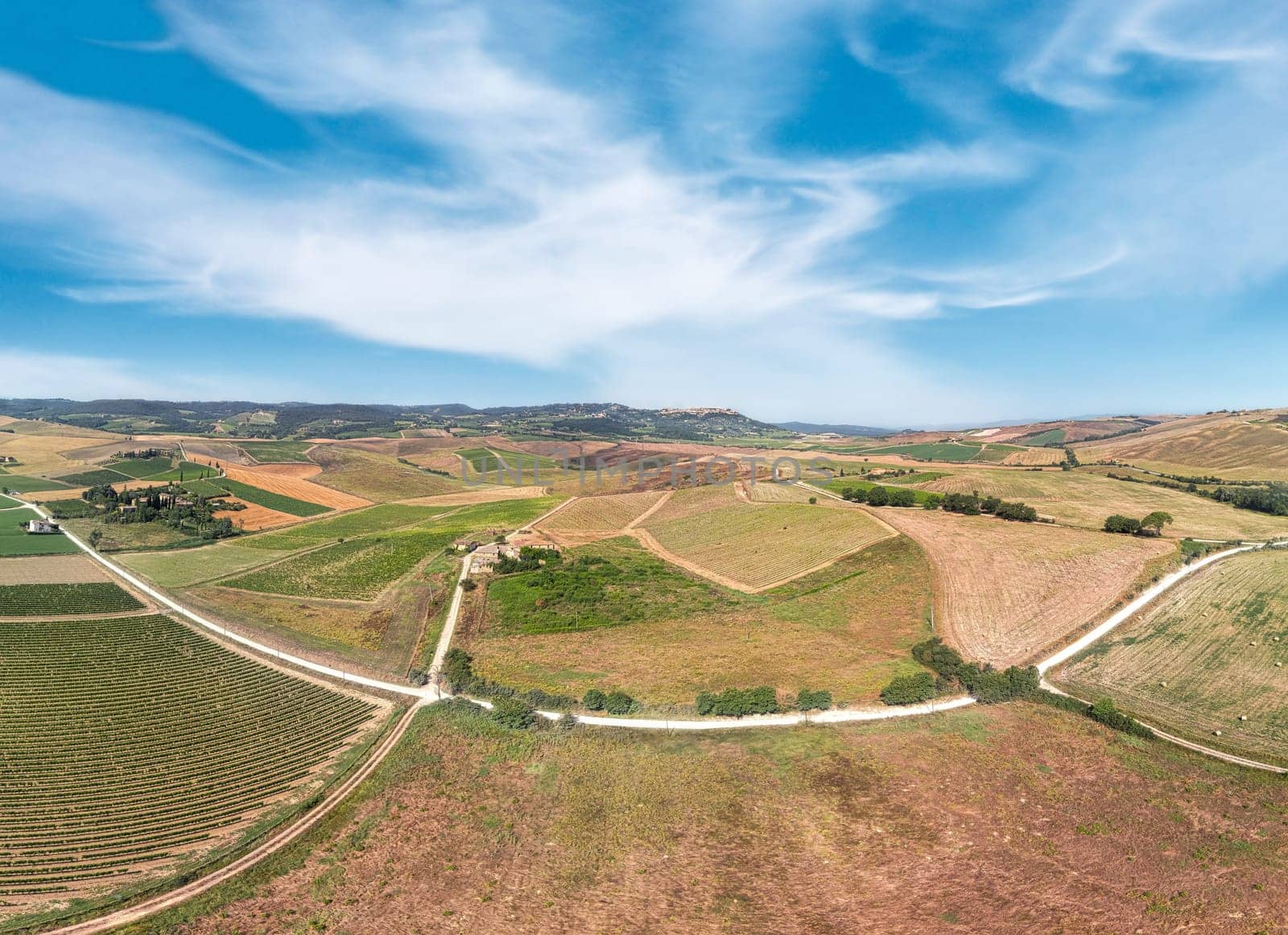 Tuscan landscape on a road of cypress trees near San Quirico d Orcia, Italy