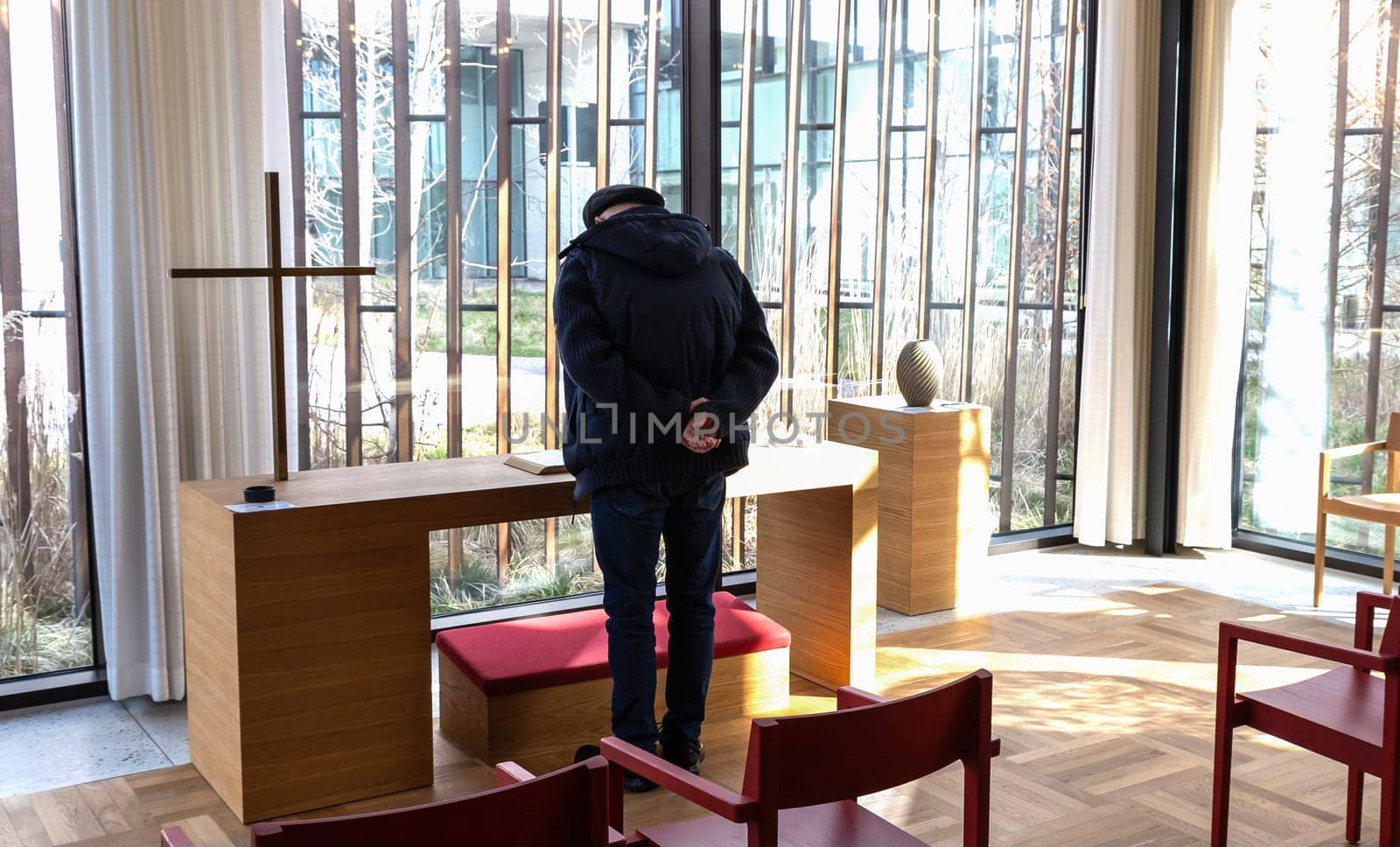 Church room for prayer and privacy with a large cross and chairs for visitors. Herlev hospital, Denmark.
