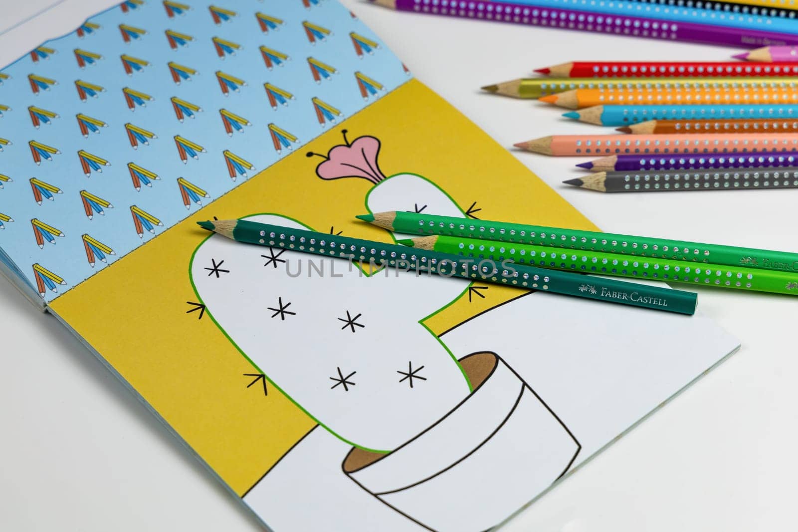 Faber-Castell colored pencils for drawing various colors andcoloring book for children. Copenhagen, Denmark - January 24, 2024