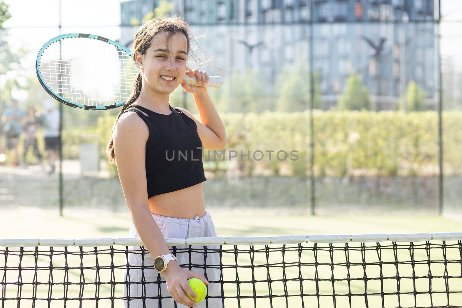 teenage tennis player woman on court with racket. High quality photo