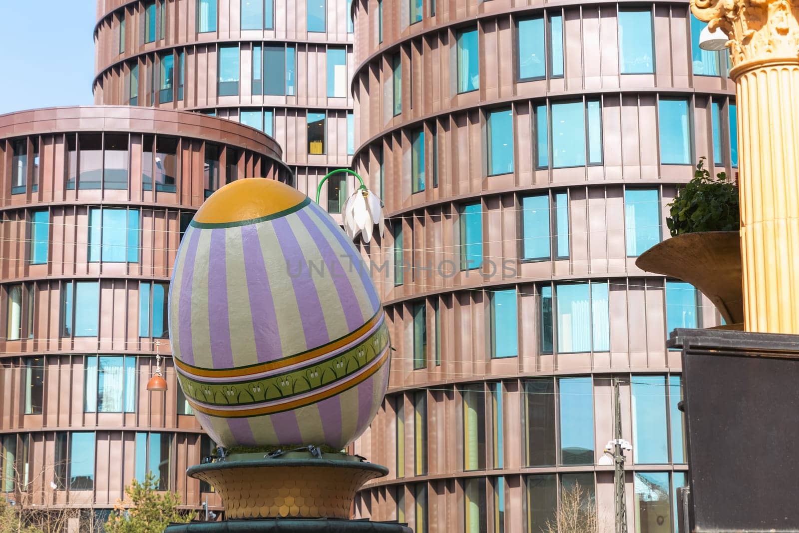 A large decorative Easter egg against a modern building in the city of Copenhagen, Denmark