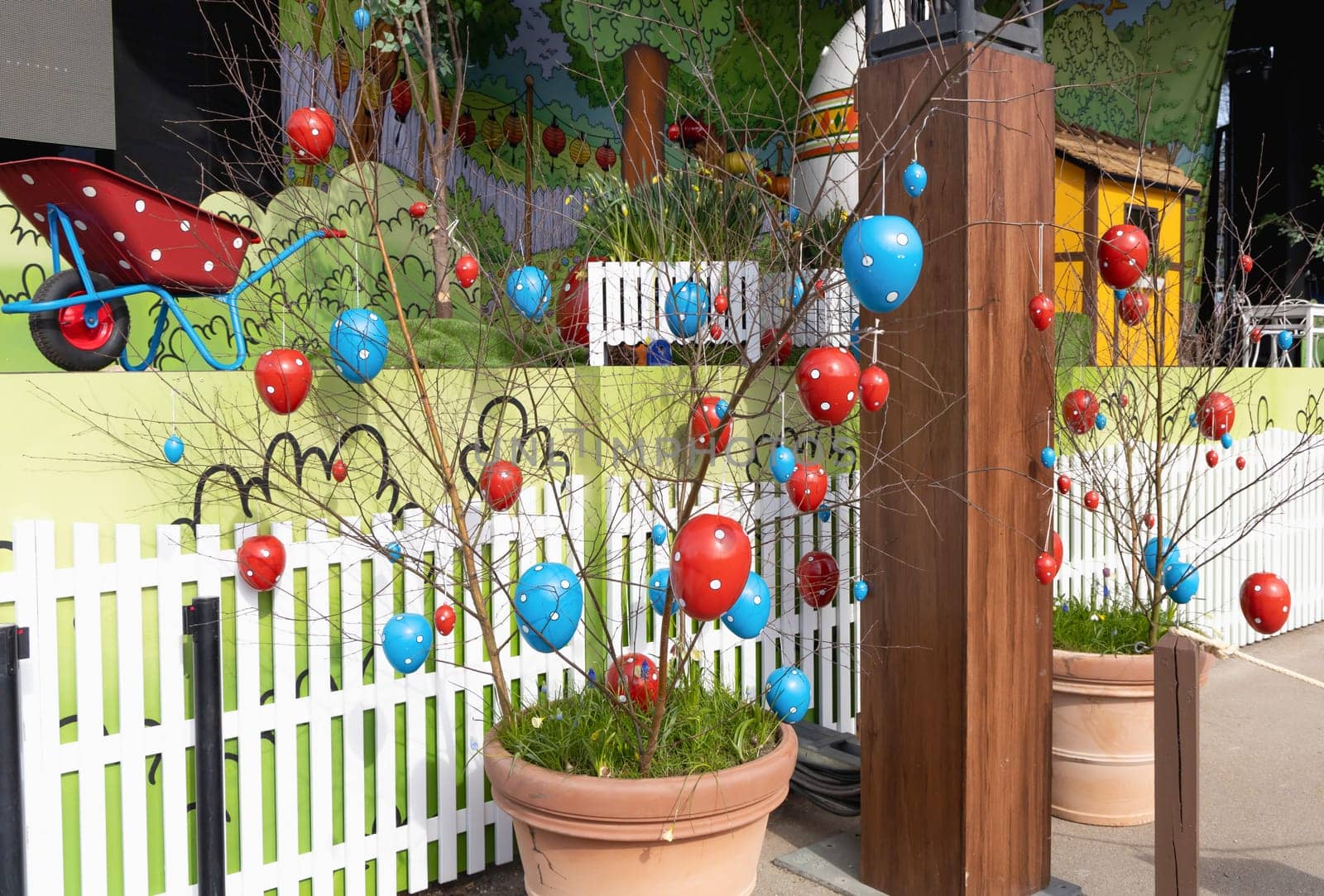 Decorative Easter eggs hanging on tree branches. Easter concept.
