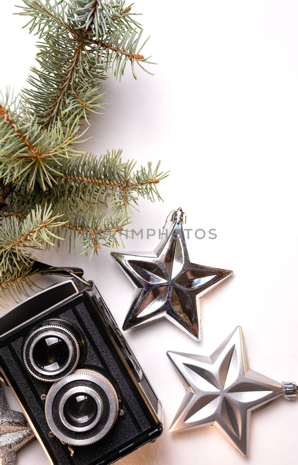 retro camera and Christmas toys on the background.