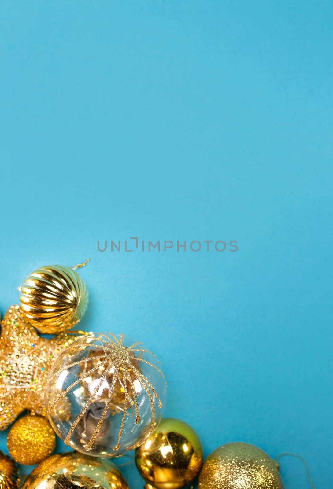 golden Christmas toys on a blue background.