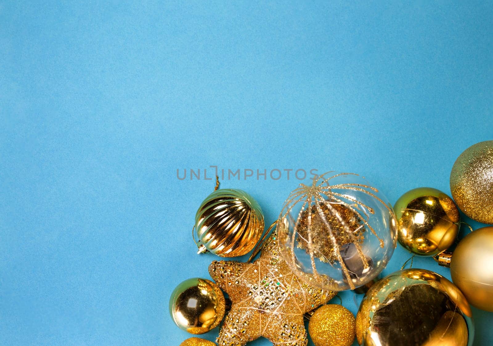 New Year or Christmas backgrounds: golden toys , top view, copy space.