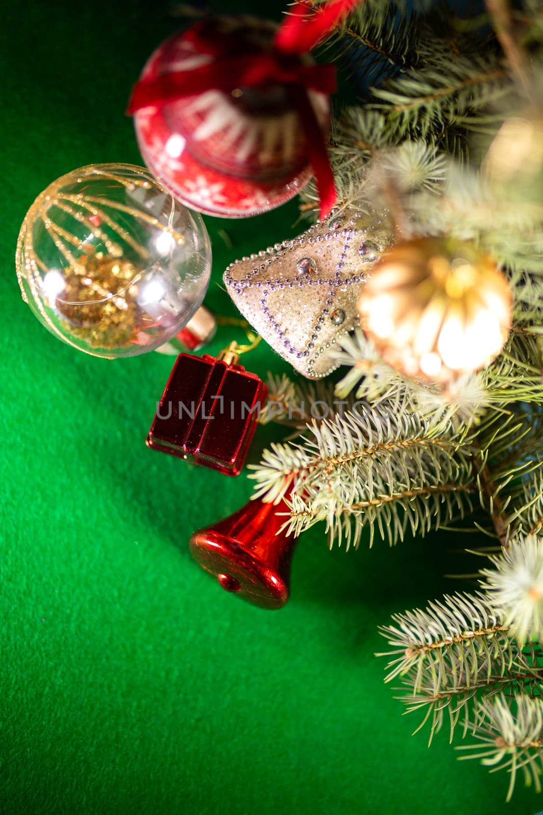 Christmas toys on the Christmas tree on a green background.