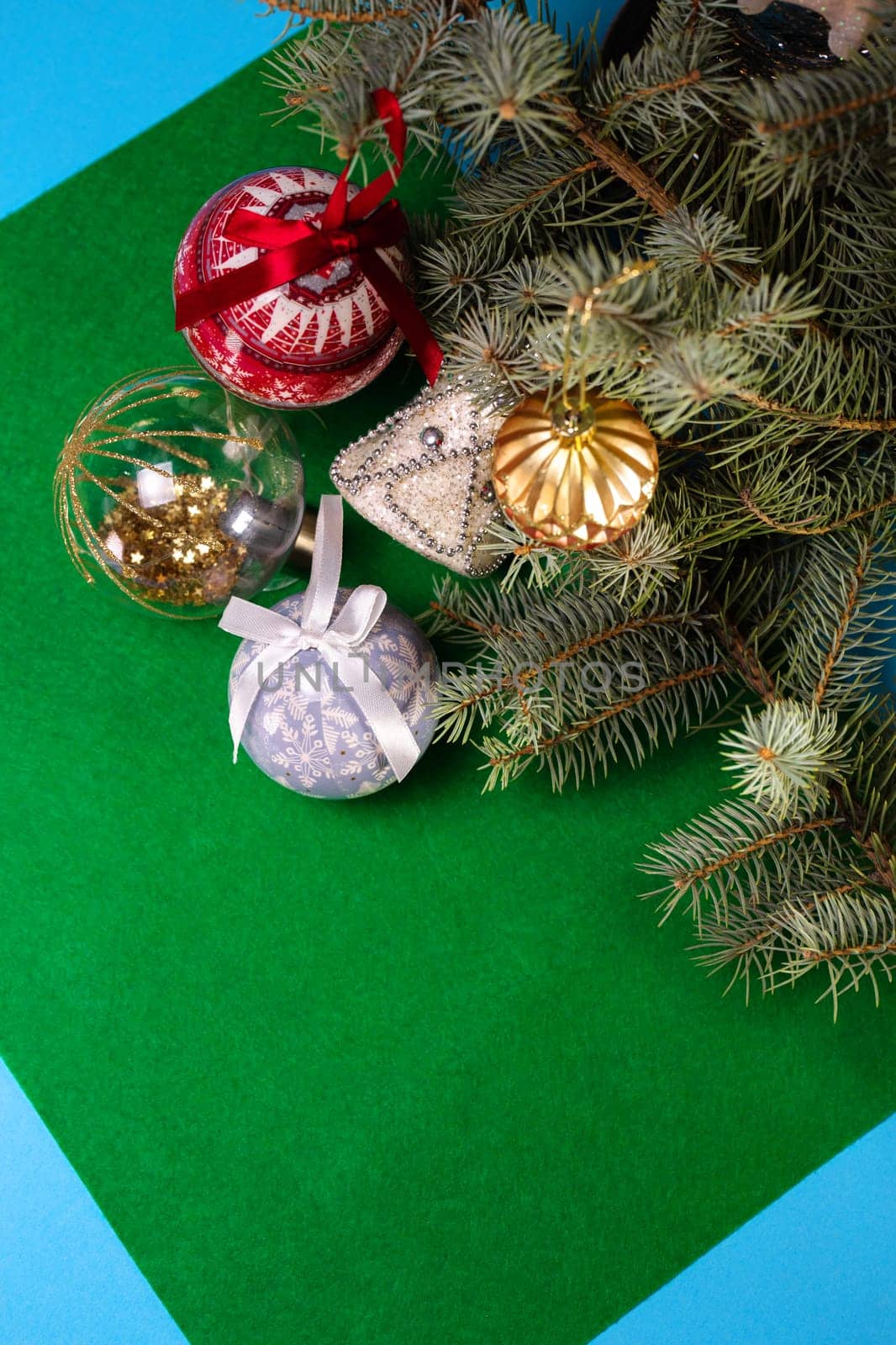 Christmas toys on the Christmas tree on a green background.