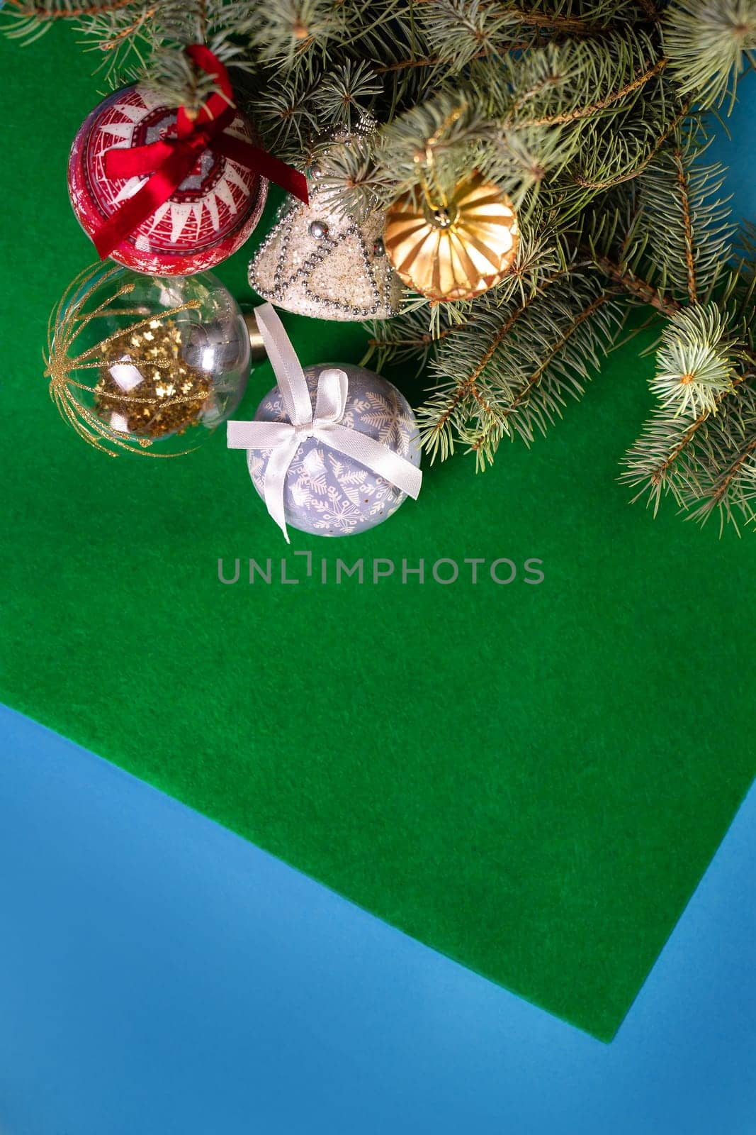 Green Christmas background with Christmas tree, toys and Christmas tree.