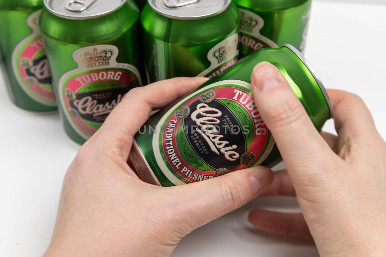 Danish beer in cans Tuborg Classic. The most popular beer. Copenhagen, Denmark - March 4, 2024.