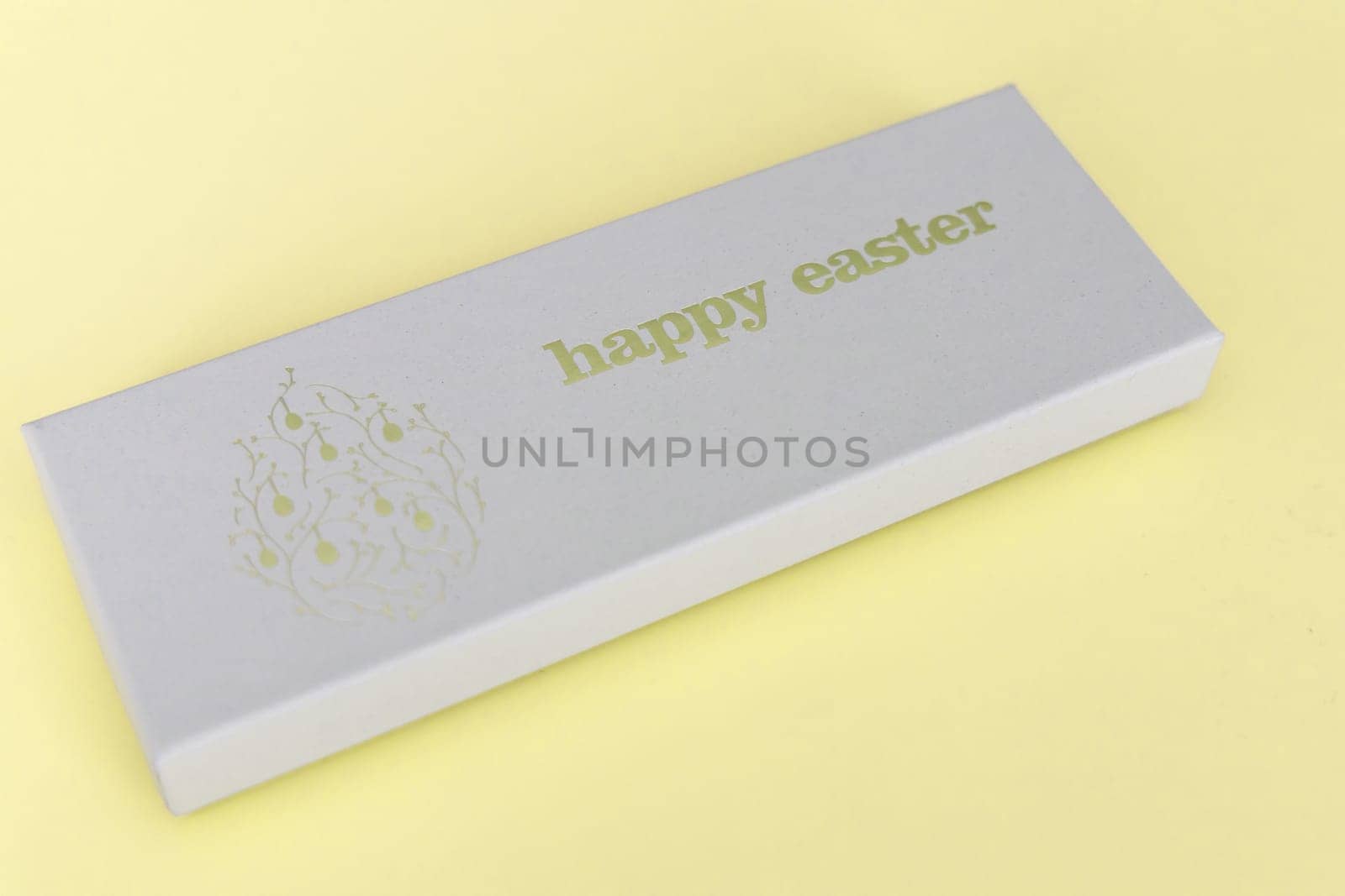 A box of chocolate eggs with the inscription in English Happy Easter. Easter concept.