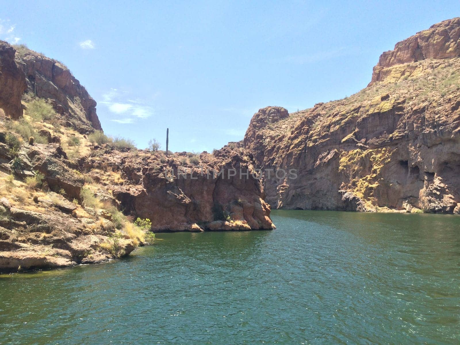 Rugged Rocky Shoreline of Canyon Lake, Arizona. View from Boat. Water recreation in the Arizona desert. High quality photo